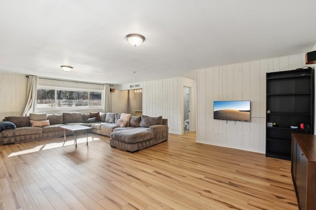 living room with light hardwood / wood-style floors