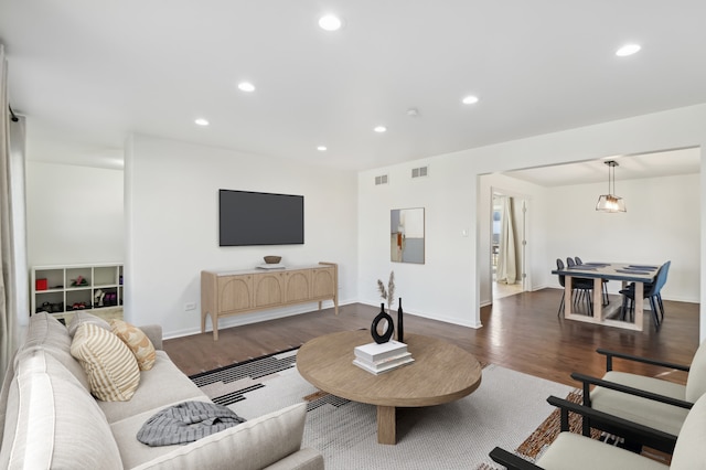 living room featuring dark hardwood / wood-style floors