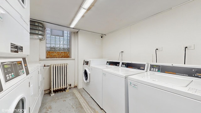 laundry area with radiator and washing machine and dryer