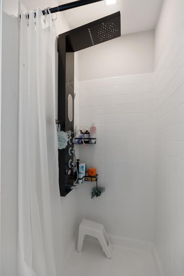 bathroom featuring a shower with curtain