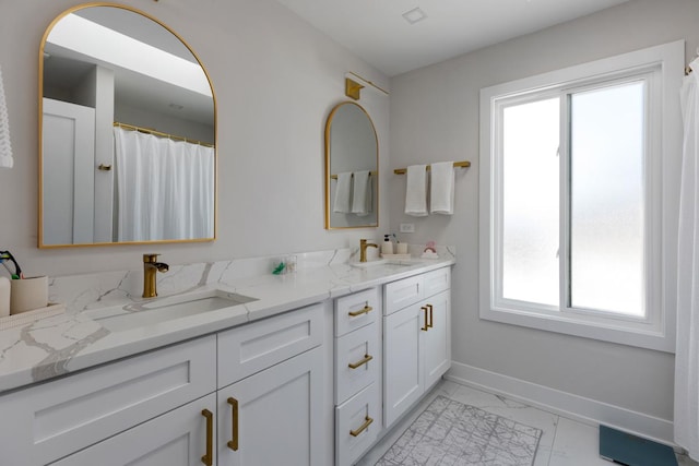 bathroom with vanity and a wealth of natural light