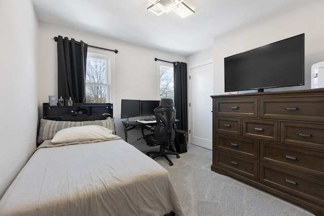 bedroom featuring light colored carpet