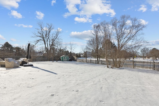 view of yard layered in snow