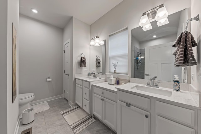 bathroom with walk in shower, vanity, and toilet