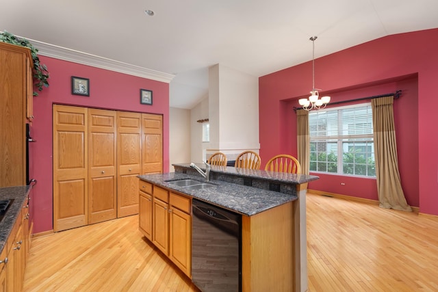 kitchen with pendant lighting, dishwasher, sink, an island with sink, and a chandelier