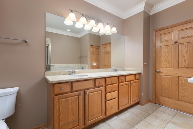 bathroom featuring tile patterned floors, crown molding, vanity, and toilet