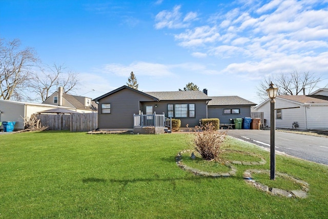 ranch-style house with a front lawn