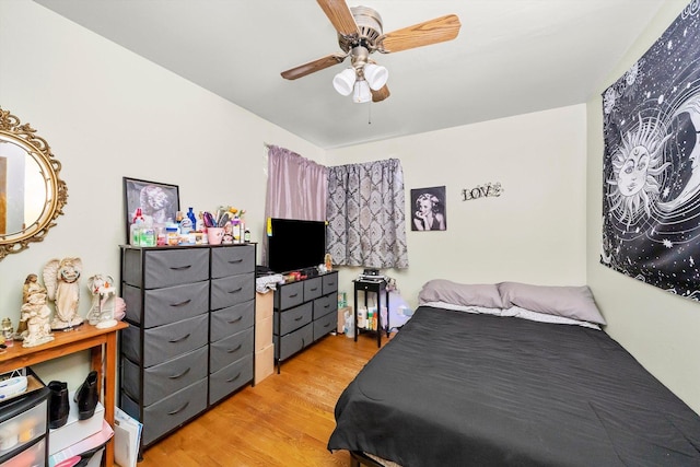 bedroom with ceiling fan and light wood-type flooring