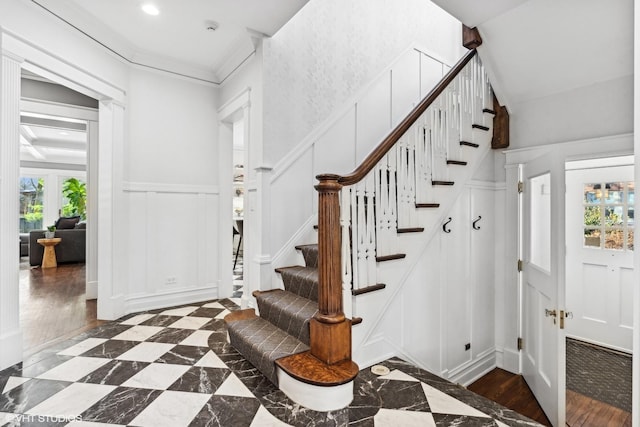 entrance foyer featuring ornamental molding