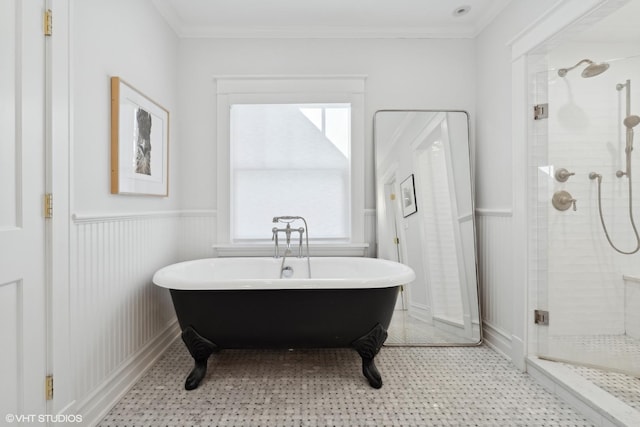 bathroom with ornamental molding, separate shower and tub, and plenty of natural light