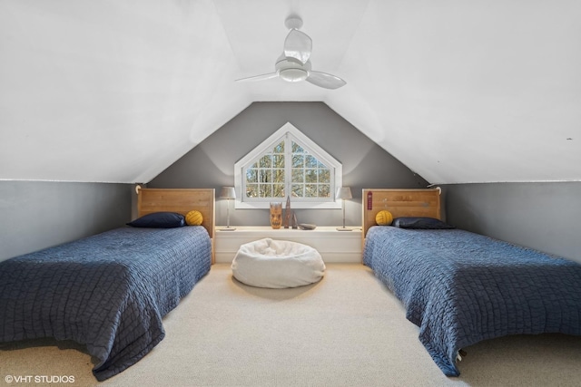 bedroom with lofted ceiling, carpet floors, and ceiling fan