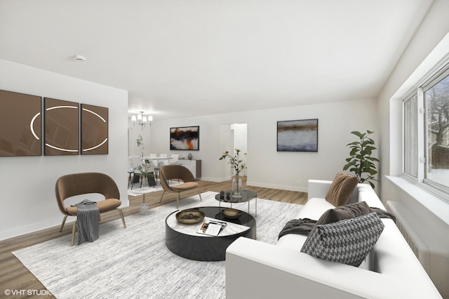 living room featuring radiator heating unit, a notable chandelier, wood finished floors, and baseboards