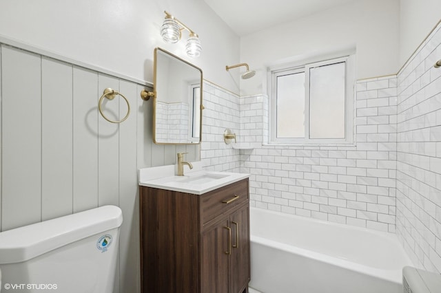 bathroom featuring vanity, toilet, and bathing tub / shower combination