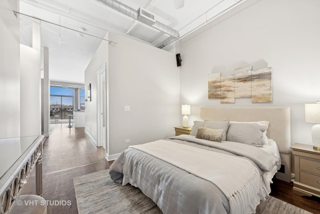 bedroom featuring ceiling fan and hardwood / wood-style floors