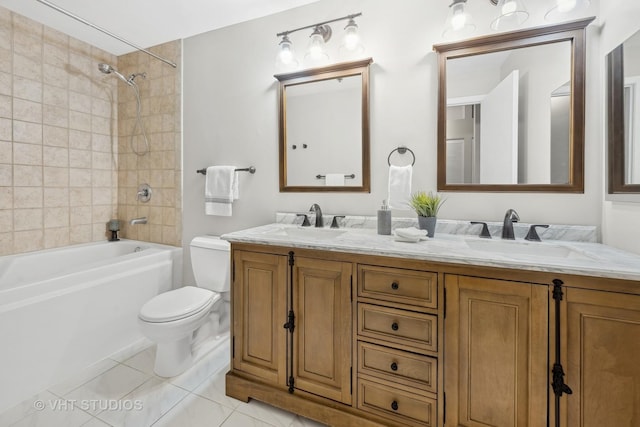 full bathroom featuring tile patterned floors, tiled shower / bath combo, toilet, and vanity