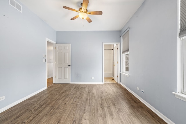 unfurnished bedroom with hardwood / wood-style flooring and ceiling fan