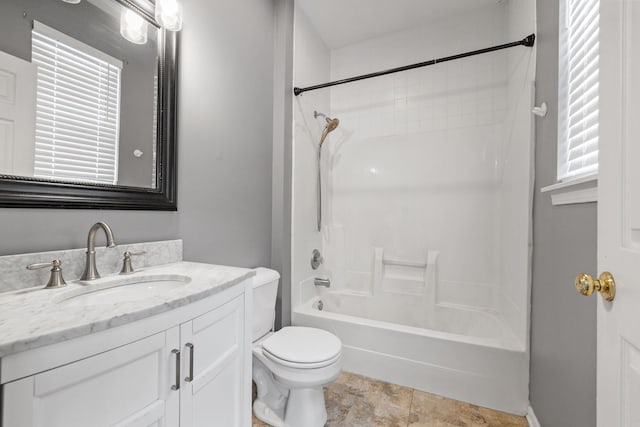 full bathroom with vanity, shower / tub combination, toilet, and a healthy amount of sunlight