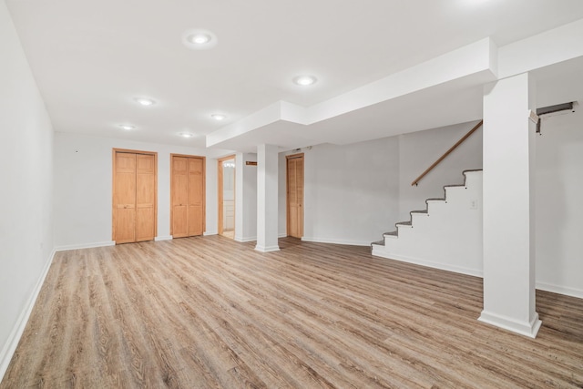 basement featuring light wood-type flooring