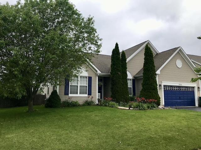 view of front facade featuring a garage and a front lawn