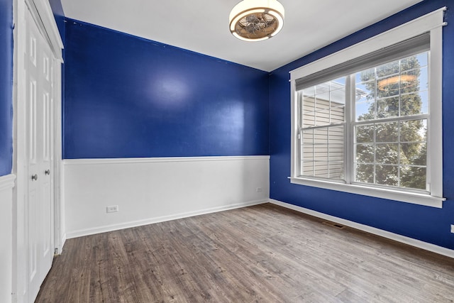 unfurnished room featuring wood-type flooring