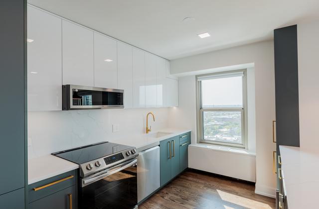 kitchen with decorative backsplash, stainless steel appliances, sink, dark hardwood / wood-style floors, and white cabinetry