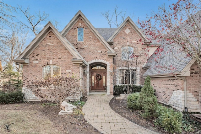 view of front of house featuring brick siding