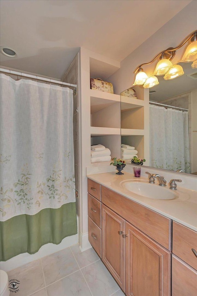 full bath featuring tile patterned floors, curtained shower, and vanity