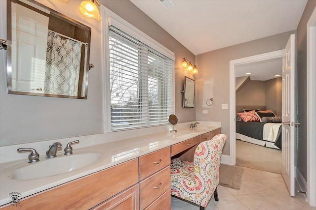 ensuite bathroom featuring ensuite bathroom, tile patterned flooring, vanity, and a shower with curtain