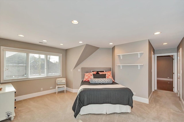 bedroom with recessed lighting, light carpet, and baseboards