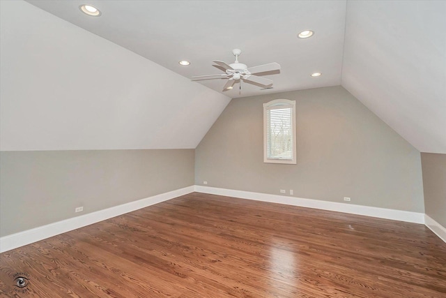 bonus room featuring lofted ceiling, ceiling fan, recessed lighting, wood finished floors, and baseboards