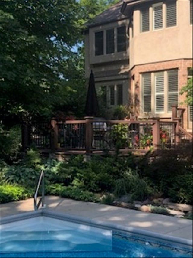 back of house with stucco siding