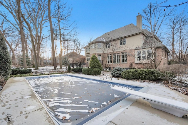 view of snow covered pool