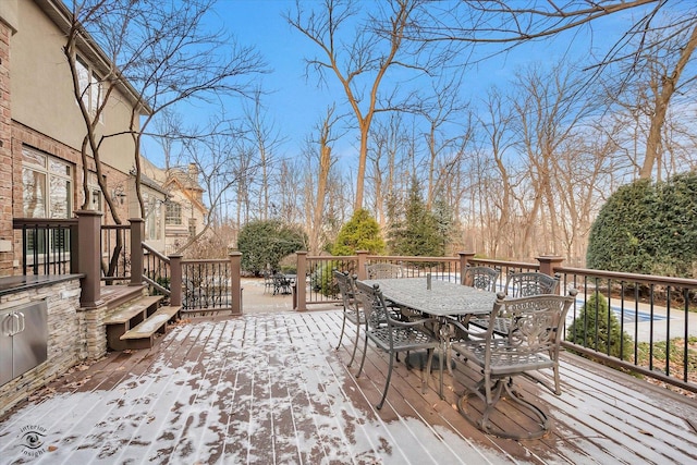 wooden deck with outdoor dining area