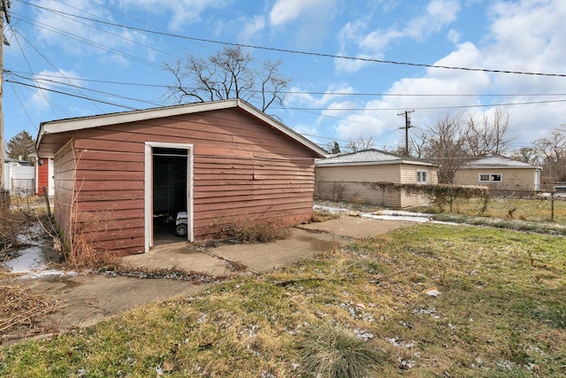 view of outbuilding with a lawn