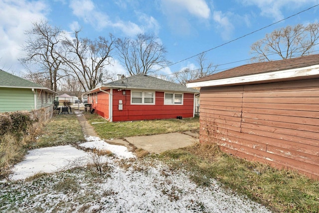 view of property exterior featuring an outdoor structure