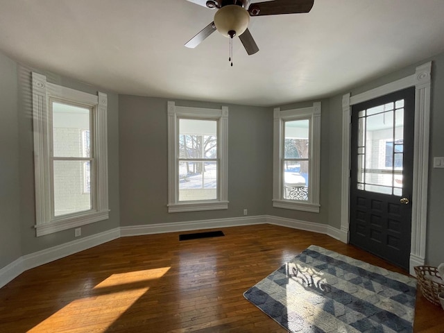 foyer entrance with dark hardwood / wood-style floors and ceiling fan