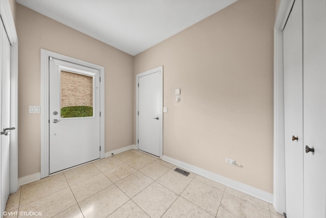 entrance foyer with light tile patterned flooring