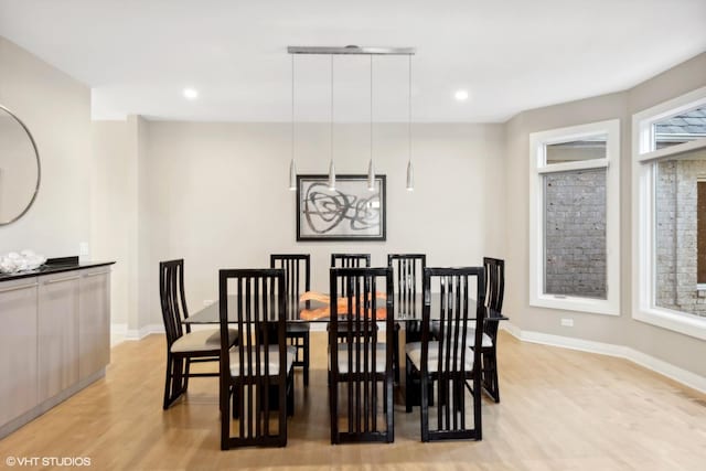 dining area with light hardwood / wood-style floors