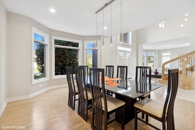 dining area featuring light wood-type flooring