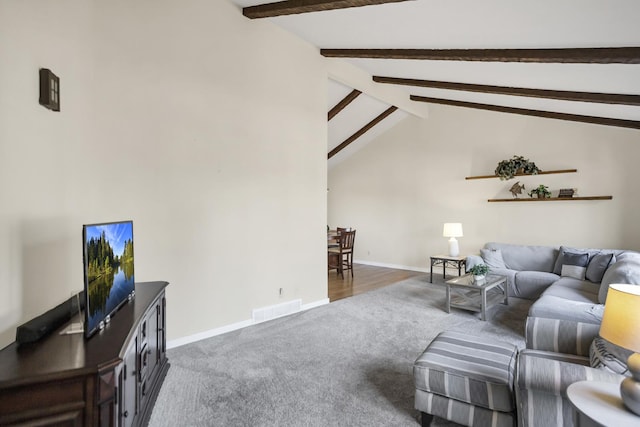 carpeted living room featuring lofted ceiling with beams, baseboards, and visible vents