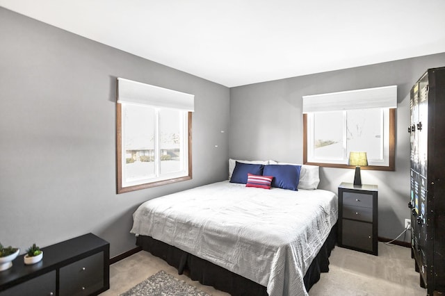 bedroom featuring carpet flooring and baseboards