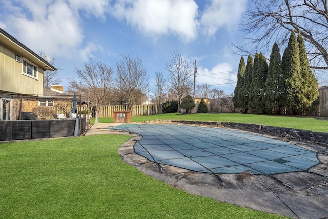 view of pool with a fenced backyard, a patio, a fenced in pool, and a yard