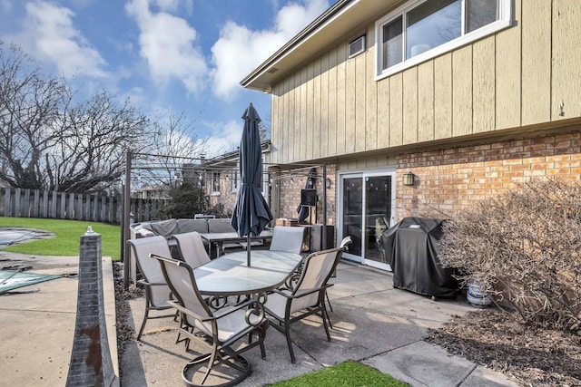 view of patio / terrace featuring outdoor lounge area, fence, and a grill