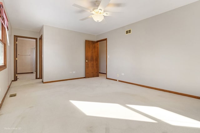 unfurnished room featuring ceiling fan and carpet flooring