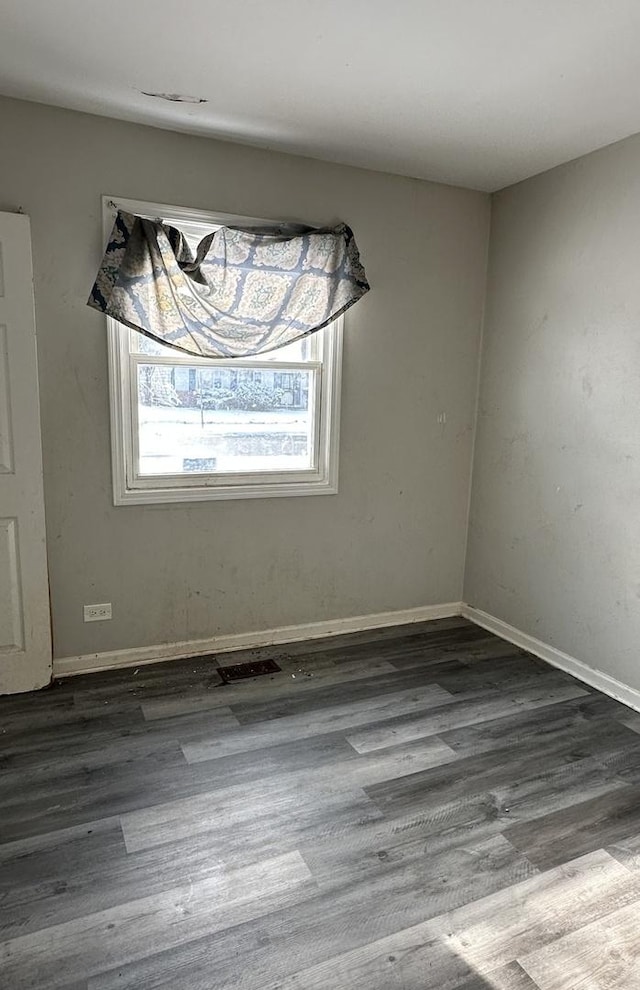 unfurnished dining area featuring dark hardwood / wood-style flooring