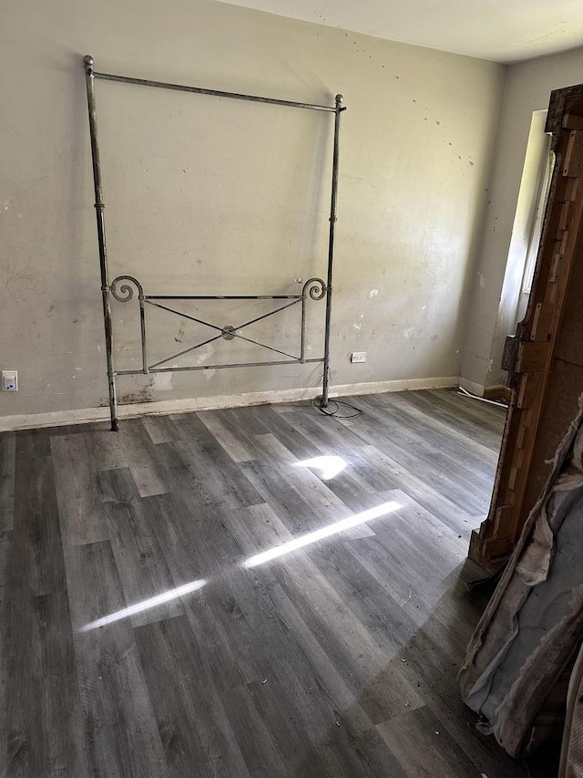 empty room with hardwood / wood-style flooring