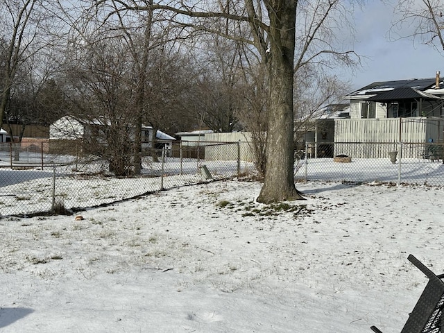 view of yard layered in snow