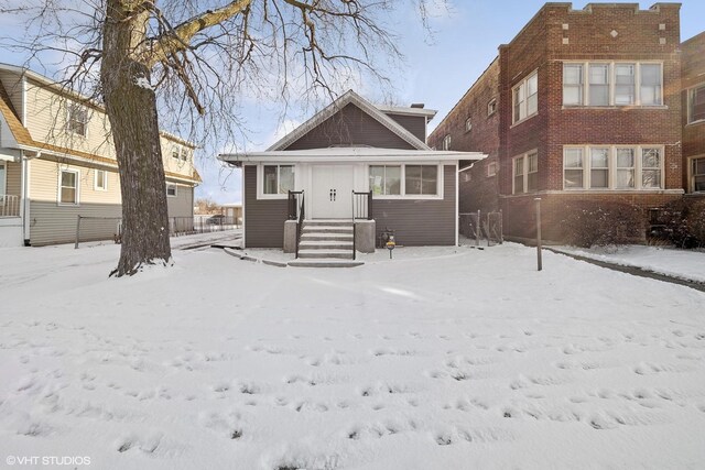 view of snow covered house