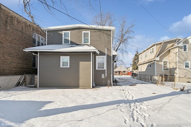 back of house featuring a residential view and fence