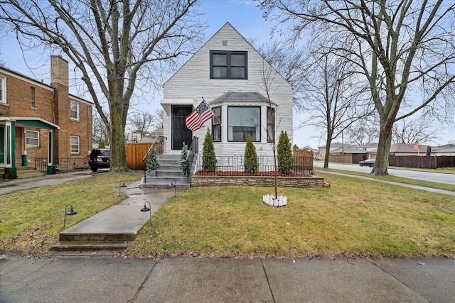 view of front of property with a front lawn